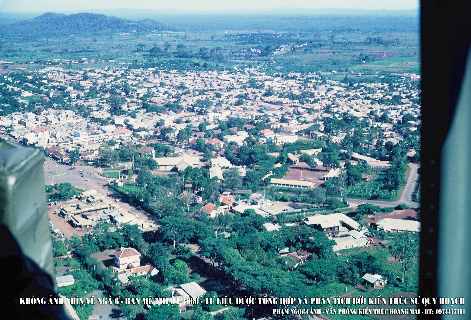 An aerial photograph of a town with a six-way road junction