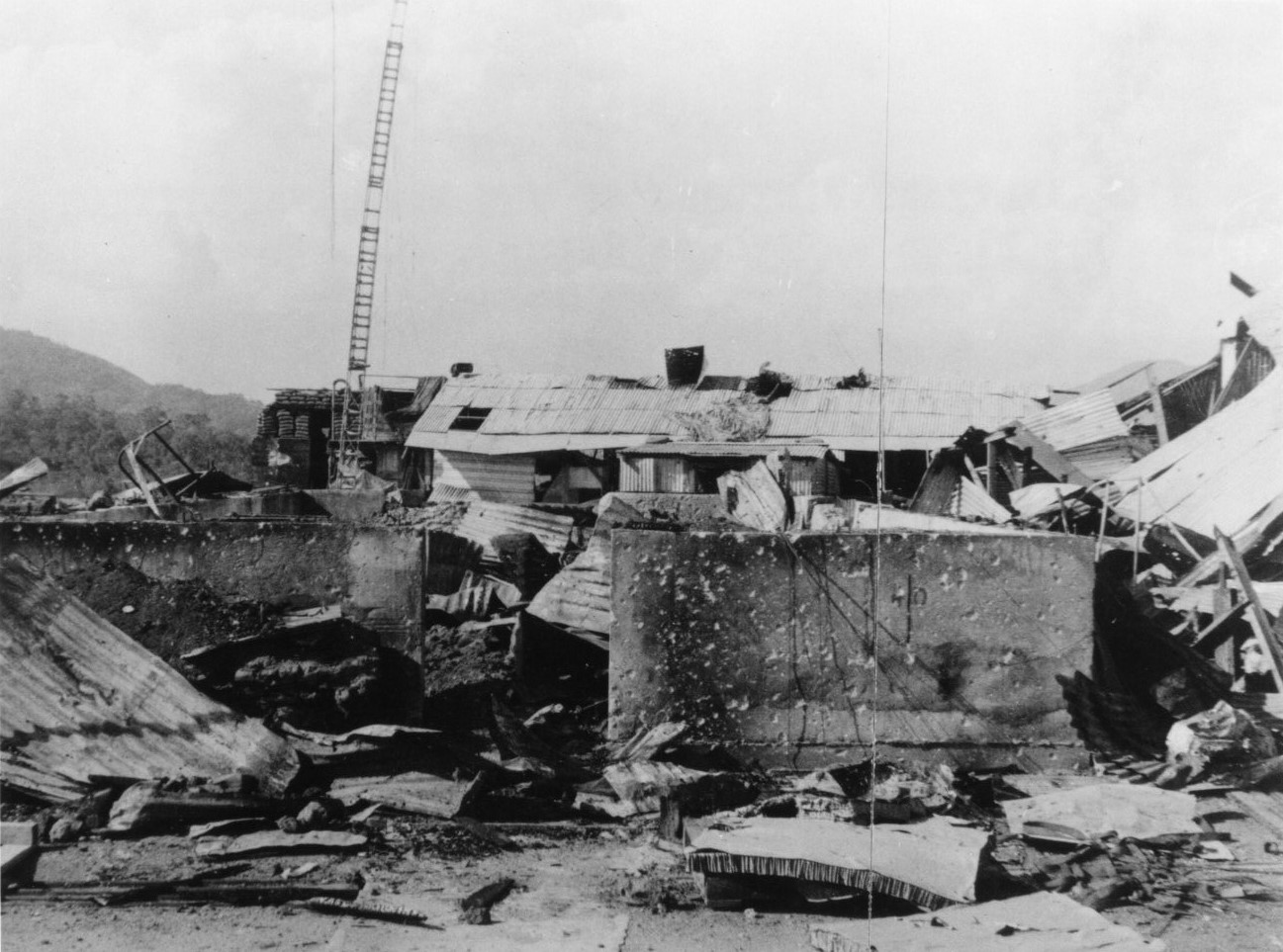 Shattered buildings and debris inside a camp