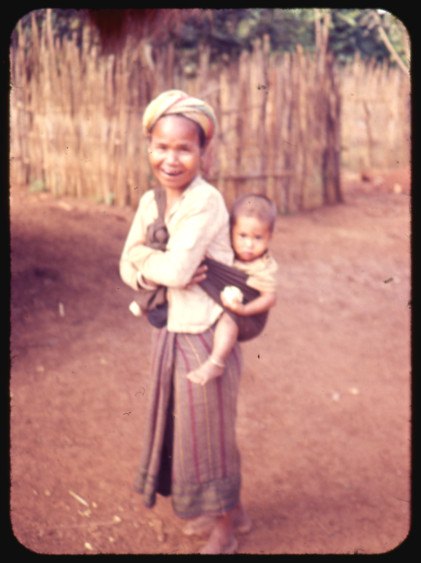 A highland mother holding a small child