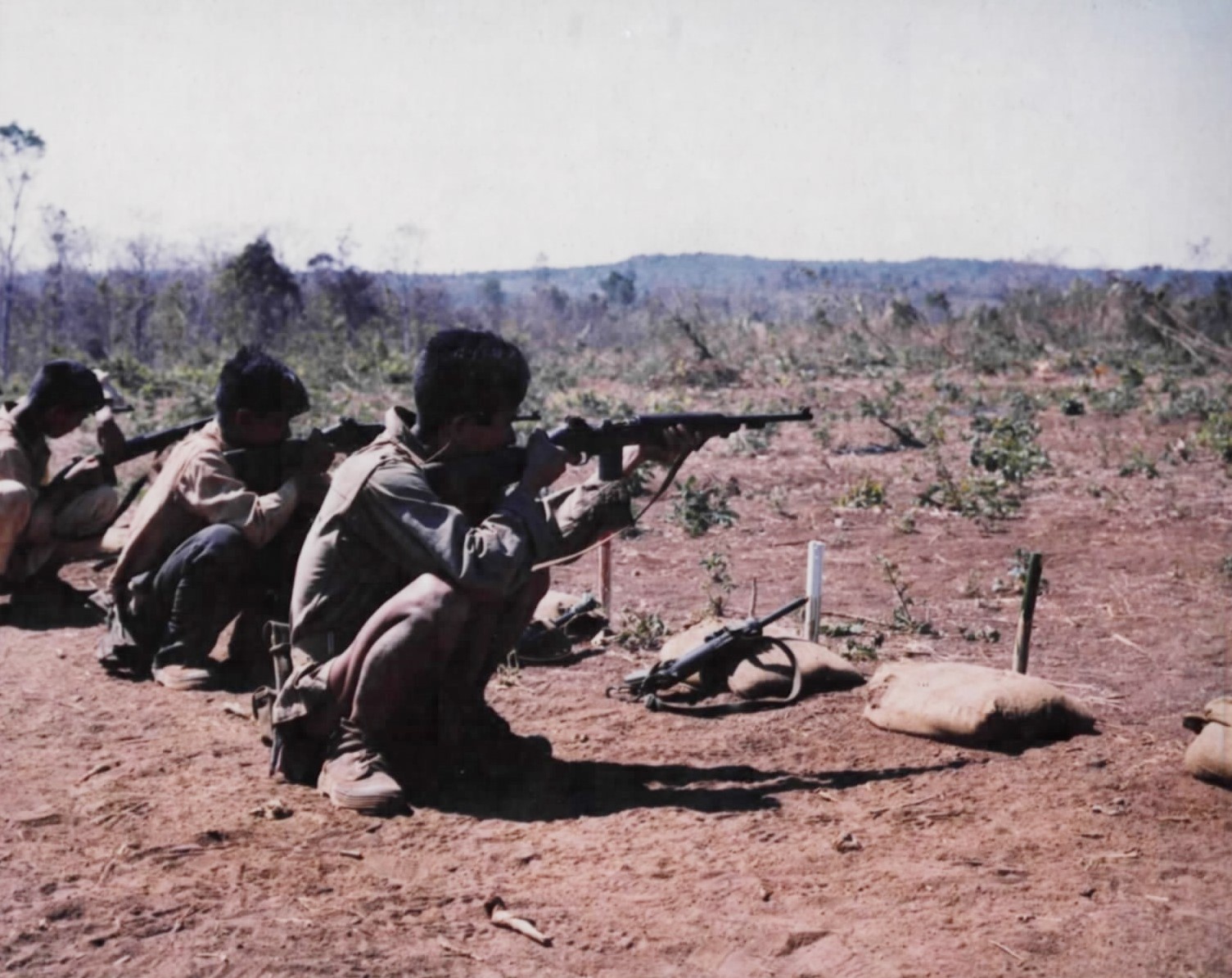 Highland commandos lying prone and firing carbines on a rifle range
