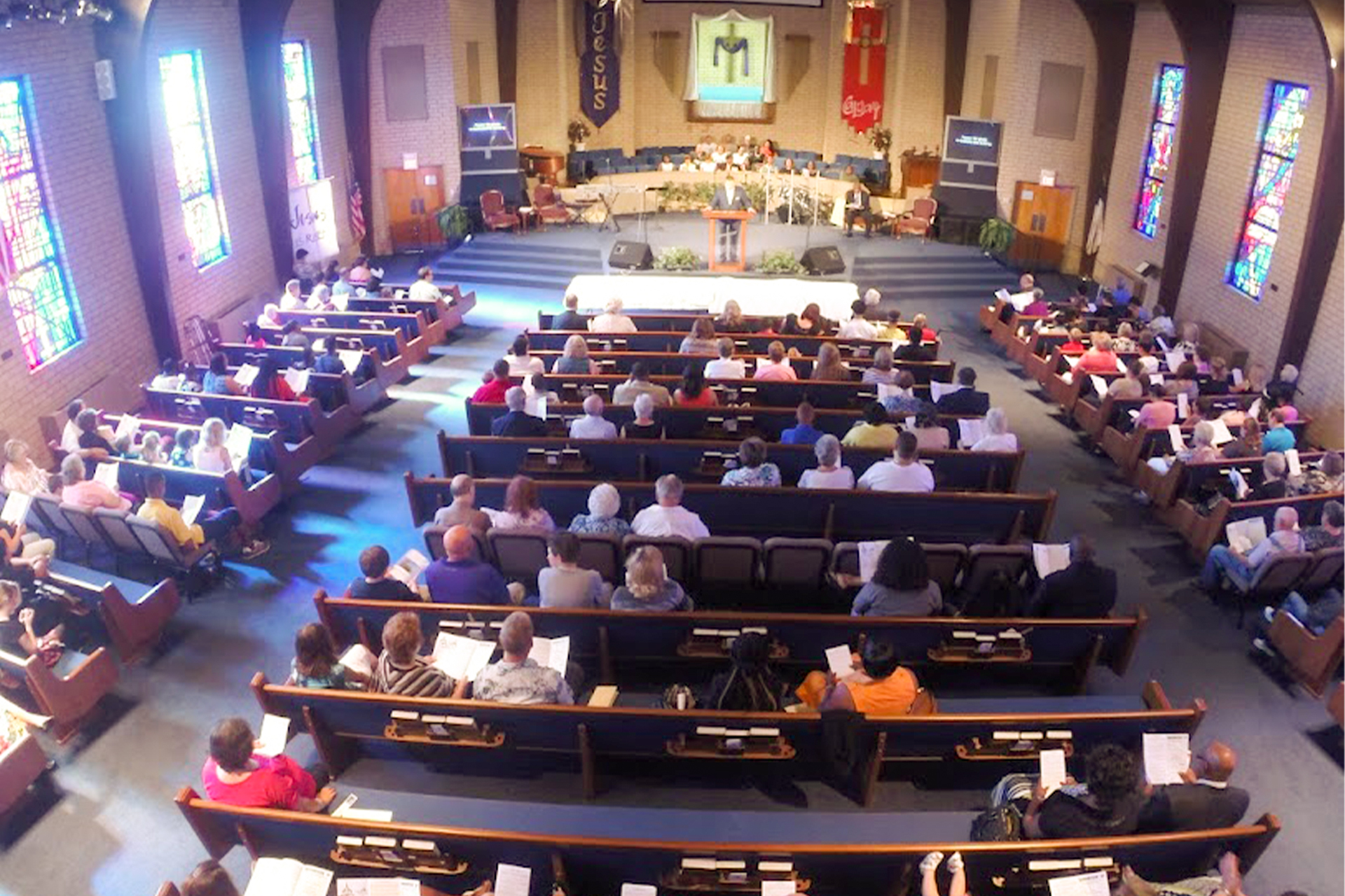 A church filled with a congregation during a prayer service