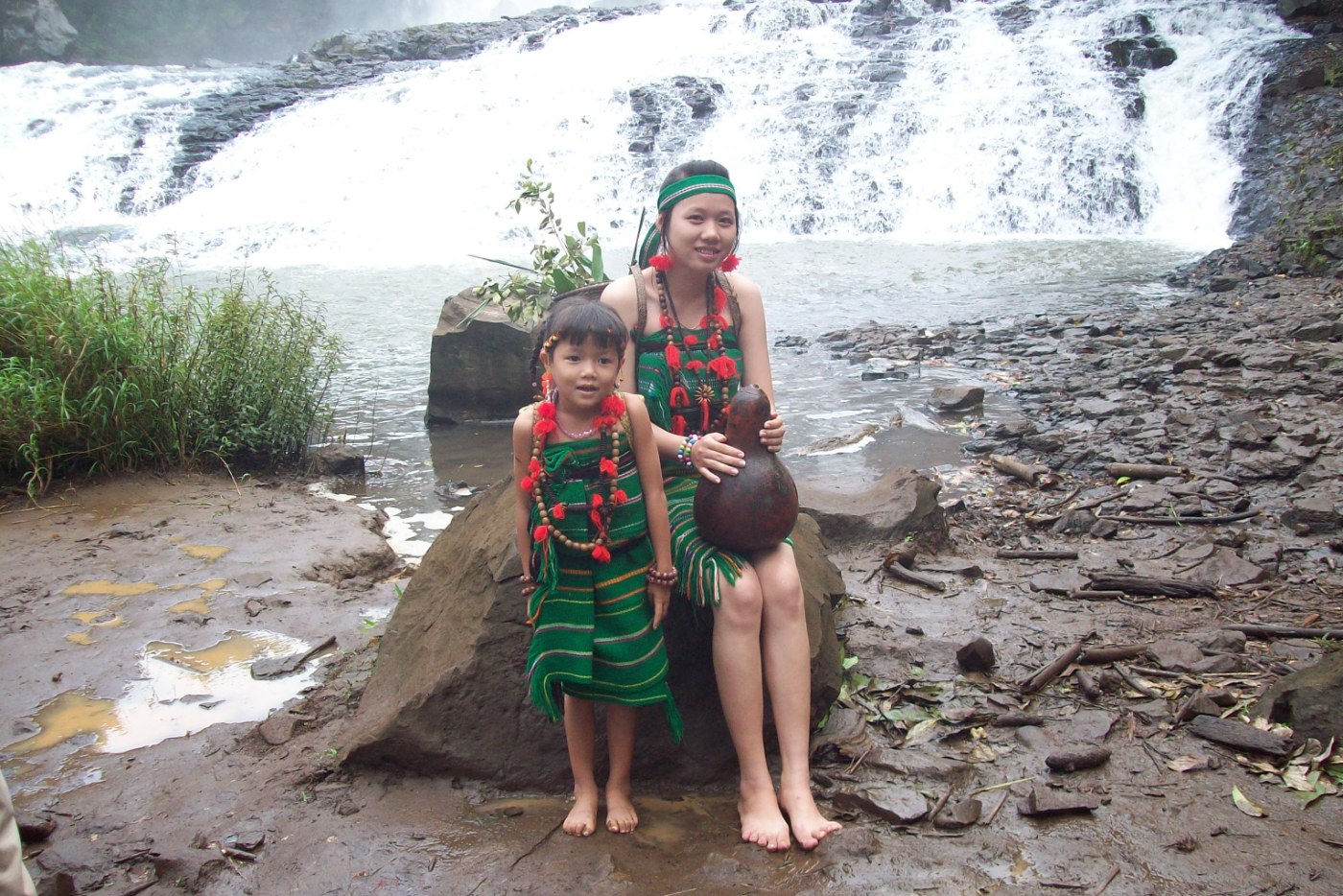 A Bunong woman and a girl in traditional dress