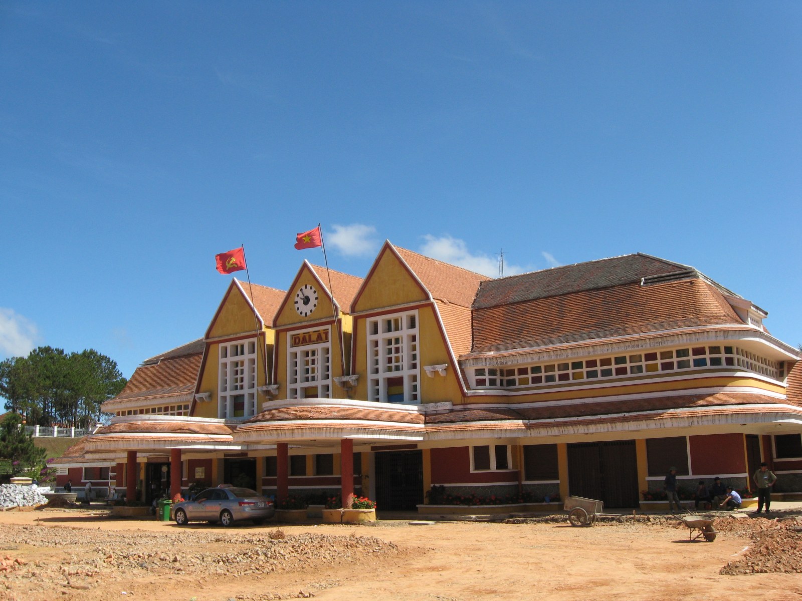 A railway station with three peaked roofs