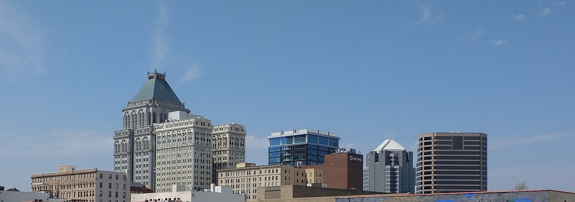 The skyline of downtown Greensboro, North Carolina, under a clear sky