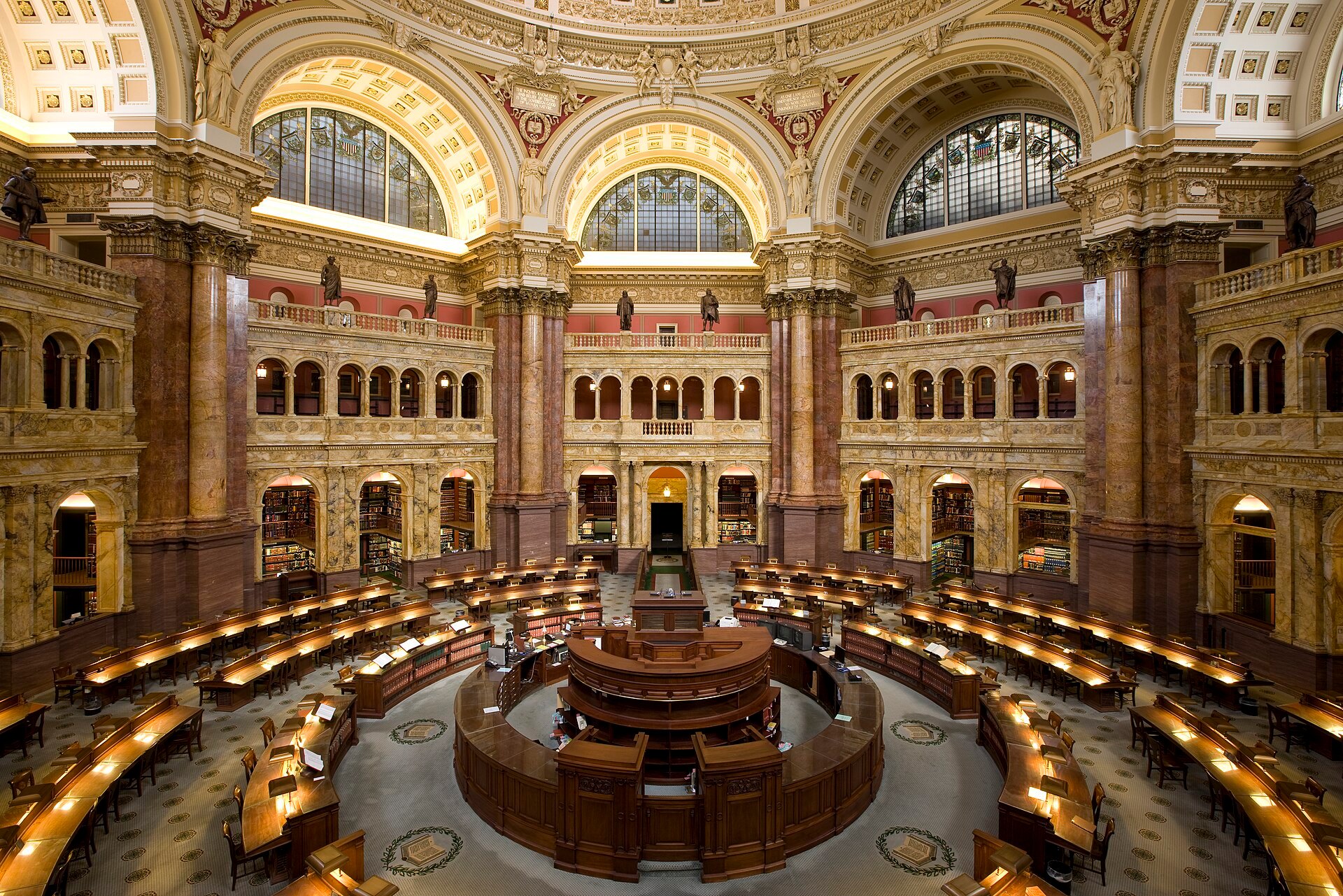 The domed Main Reading Room of the Library of Congress seen from above, with desks in concentric circles