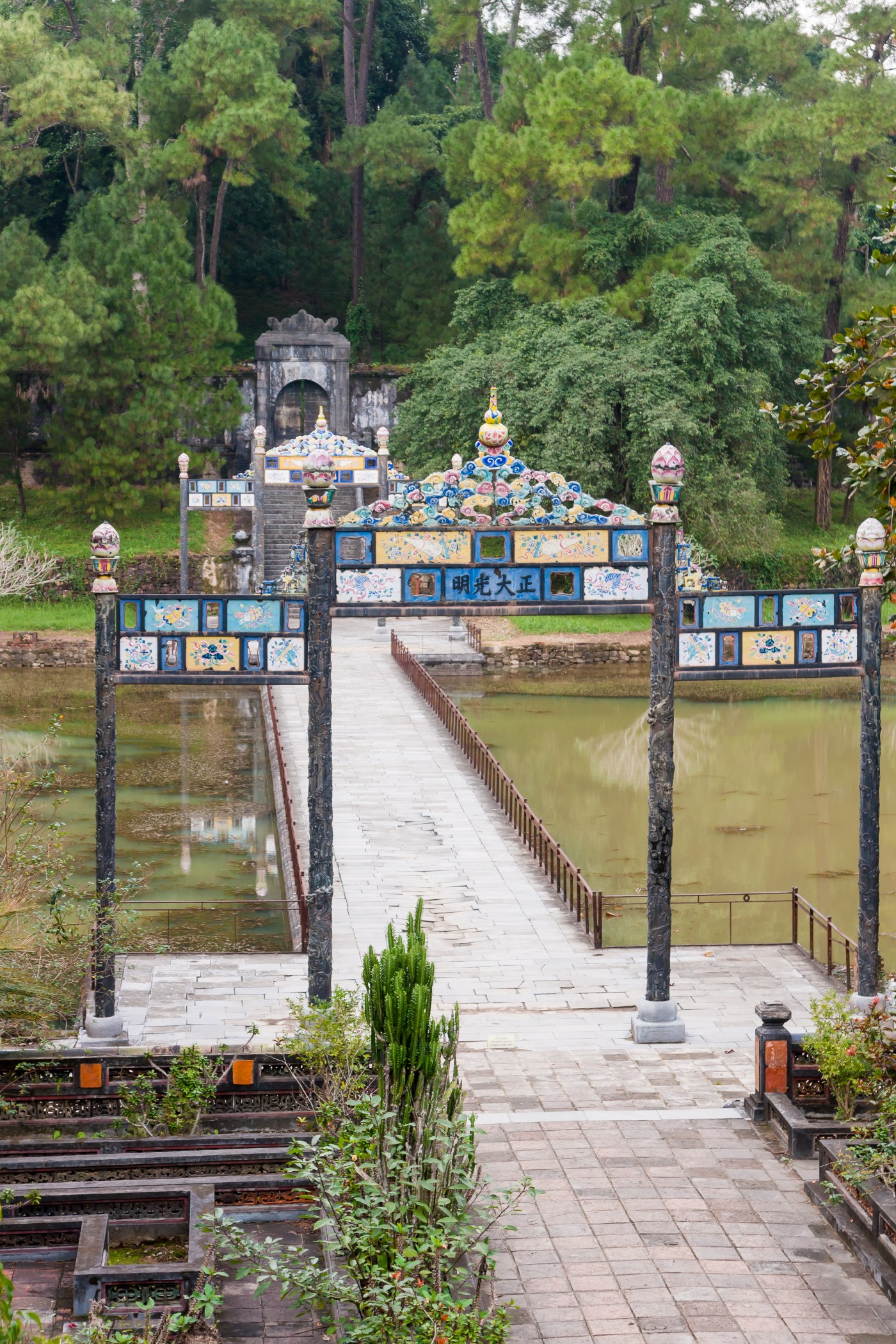 A stone bridge and gate in the tomb gardens of an emperor